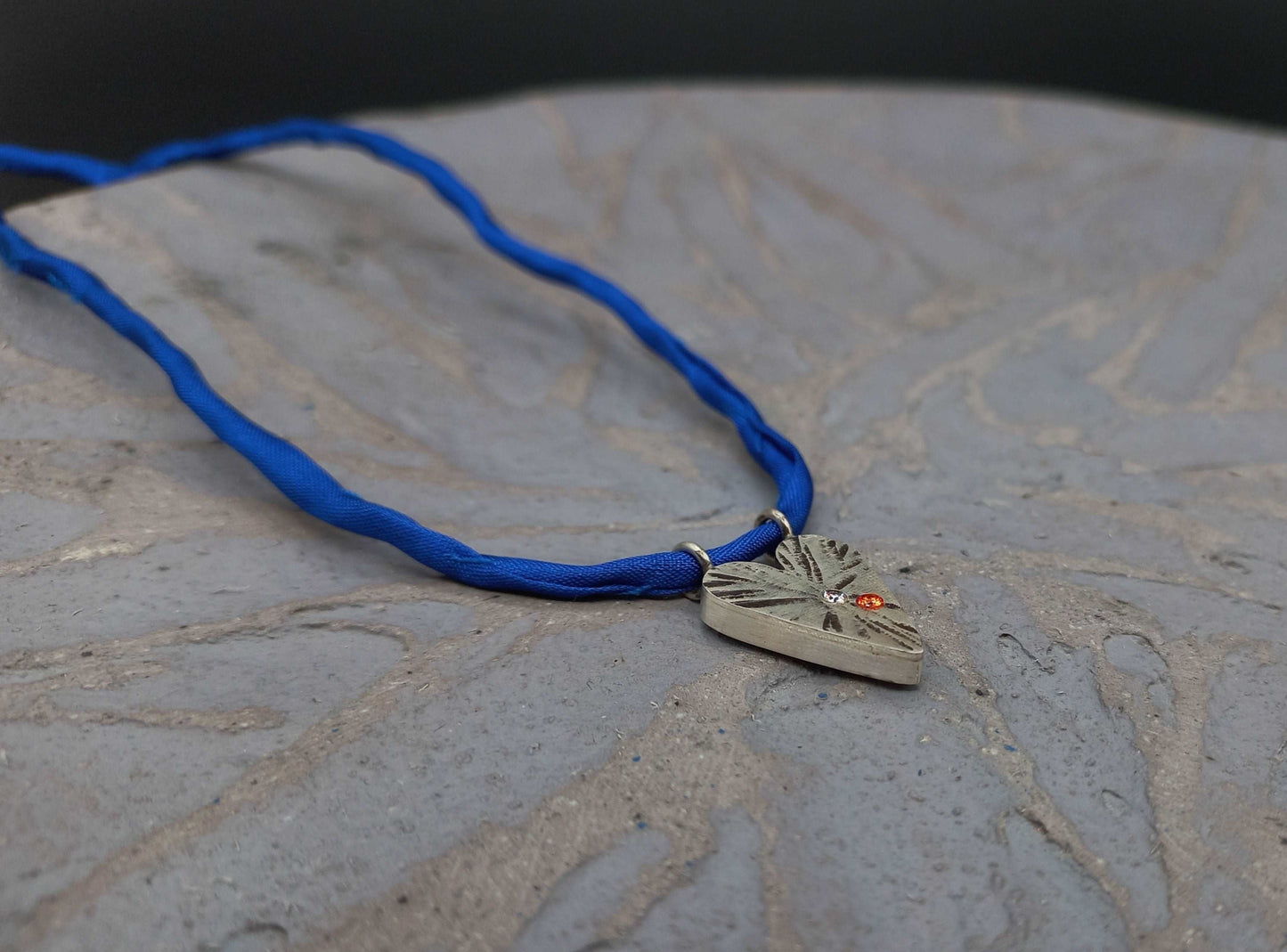 Pointed silver heart pendant orange and blue