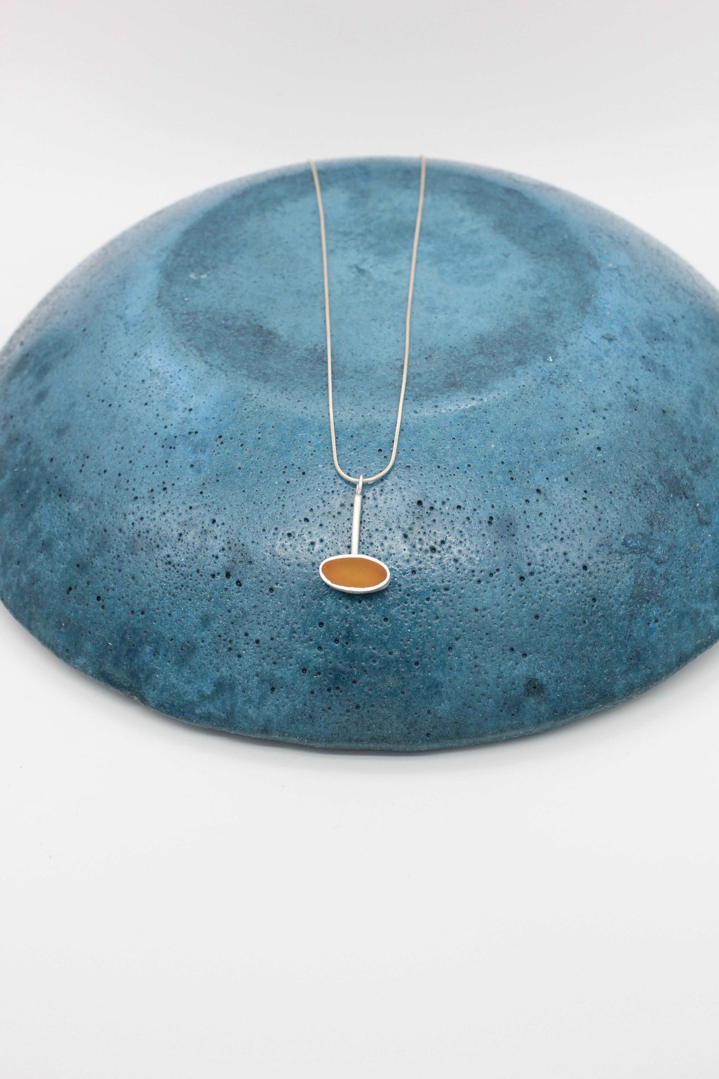 Yellow ochre oval shape pendant