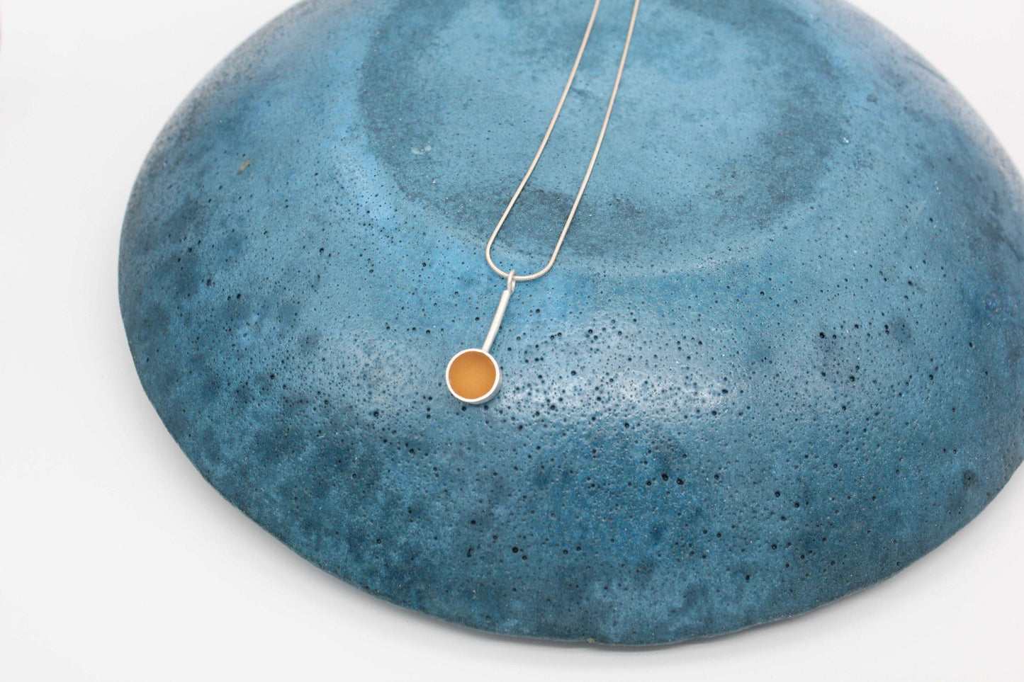 Yellow ochre round shape pendant