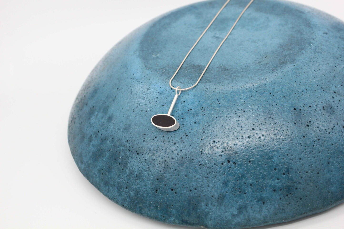 Black oval shape pendant