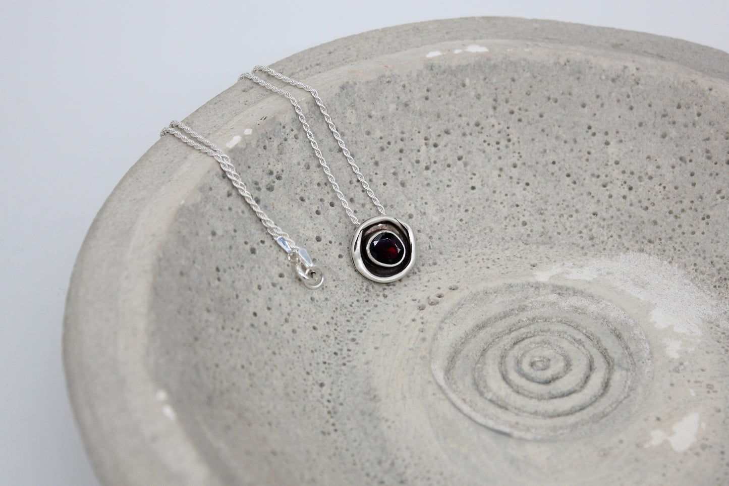 One of a kind sterling silver pendant with garnet