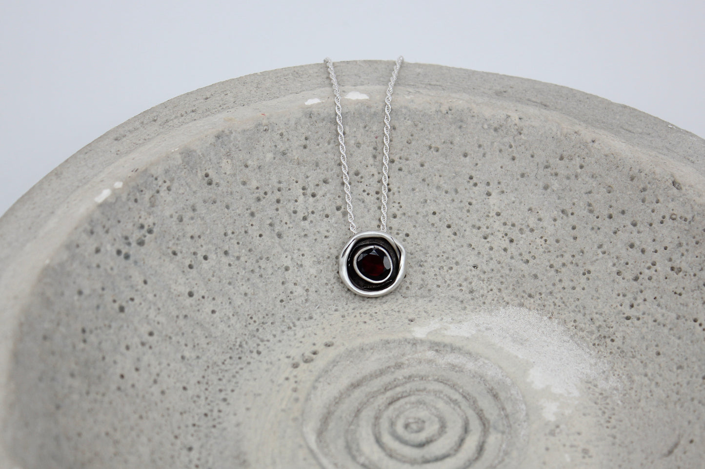 One of a kind sterling silver pendant with garnet