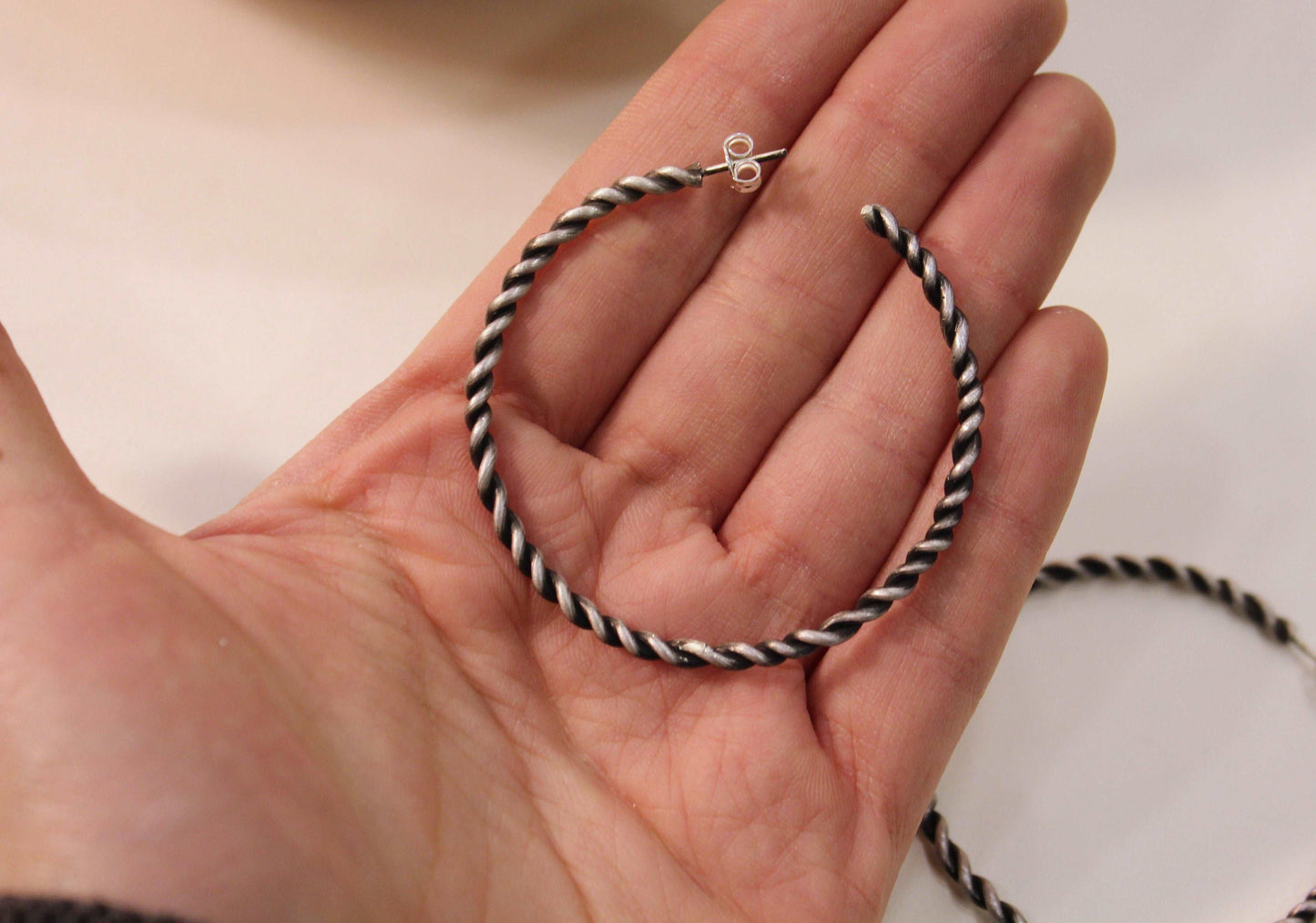 Twist silver hoops