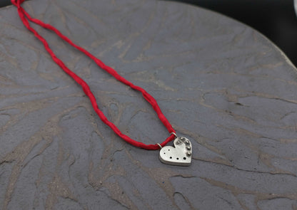 Round heart pendant with granules
