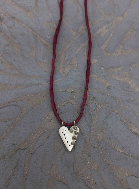 Pointed silver heart pendant with granules