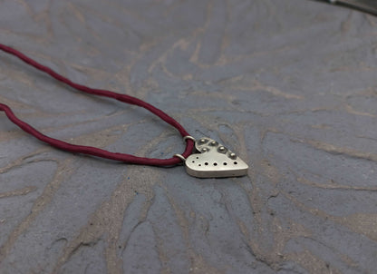 Pointed silver heart pendant with granules