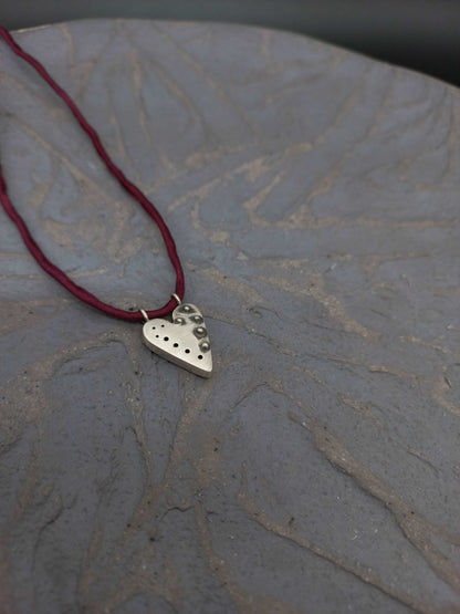 Pointed silver heart pendant with granules