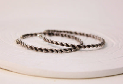 Twist silver hoops